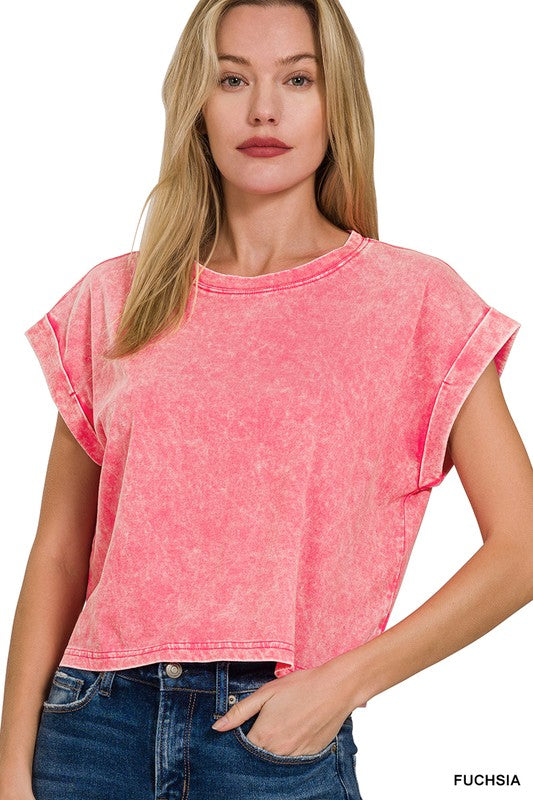 Woman wearing a pink t-shirt with 'Fuchsia' text on a white background
