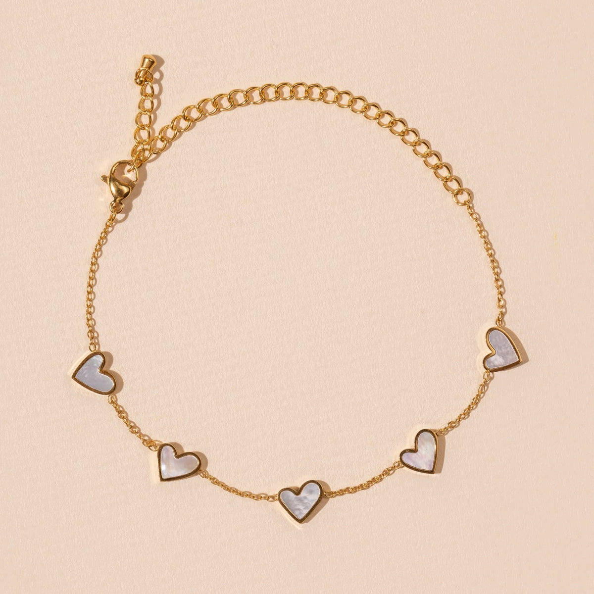 Pulsera de acero inoxidable con dijes de corazón