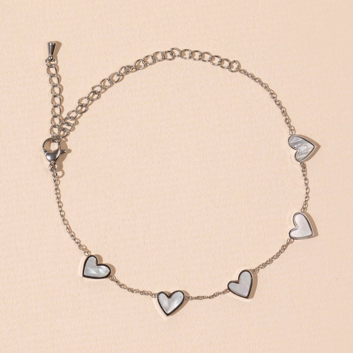 Pulsera de acero inoxidable con dijes de corazón