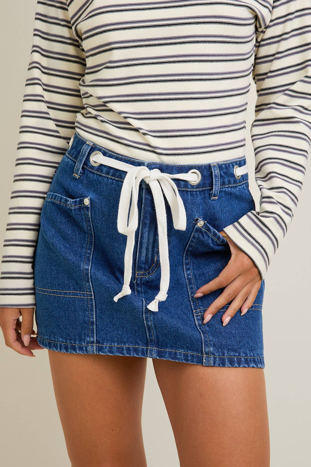 Denim Mid waist Eyelet Detail Tie Mini Skirt by Le Lis